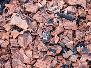 Broken roof tiles on floor of St. John's Orphanage