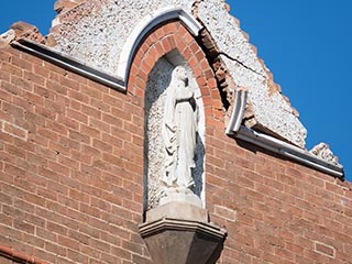 Statue on front of St. John's Orphanage