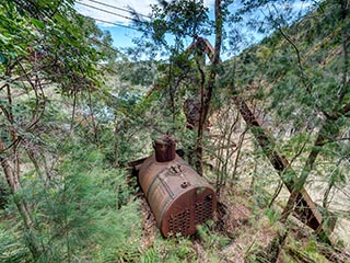 Abandoned boiler and steam crane at Wondabyne Quarry