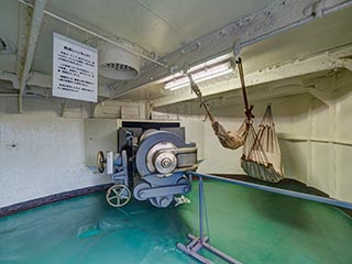 6 inch gun breech and hammocks on Battleship Mikasa