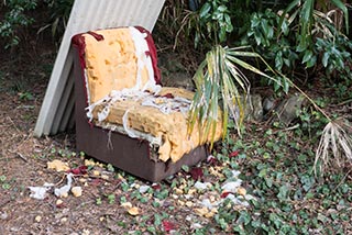 Old foam chair in courtyard of Car Hotel Mangetsu