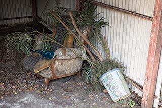 Old furniture in carport at Car Hotel Mangetsu