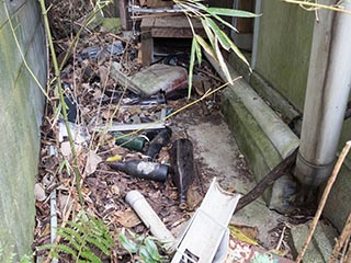 Bottles outside abandoned Japanese house