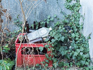 Bottles outside abandoned Japanese house