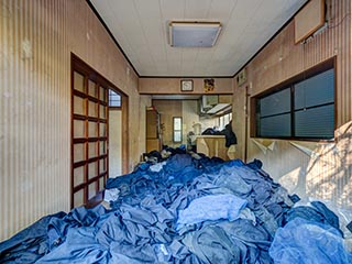 Abandoned house full of school uniforms