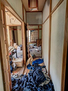 Abandoned house full of school uniforms