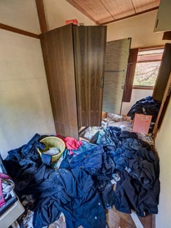 Abandoned house full of school uniforms