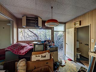 Abandoned kitchen full of junk