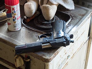 Smith & Wesson handgun in abandoned apartment