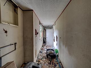 Garbage filled corridor in Hotel Bluebird