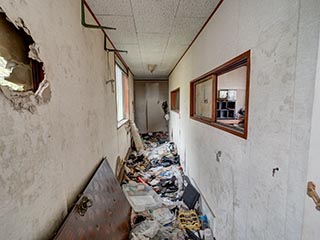 Garbage filled corridor in Hotel Bluebird