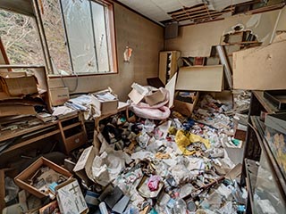 Garbage filled room in Hotel Bluebird