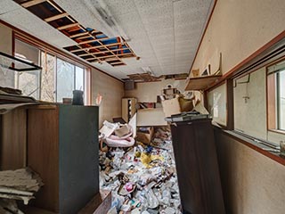 Garbage filled room in Hotel Bluebird