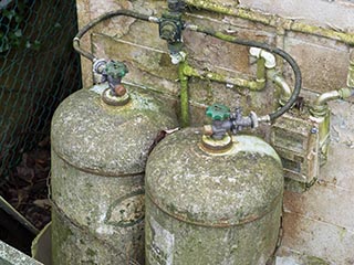 Gas tanks outside Hotel Bluebird