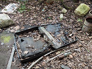 Old suitcase lying outside Hotel Bluebird