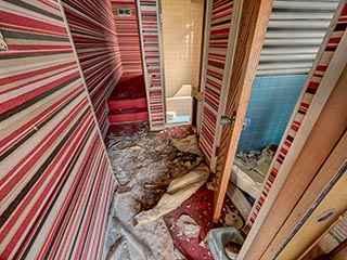 Decaying hallway in Hotel Gaia