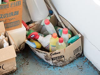 Box of cleaning supplies in Hotel New Royal