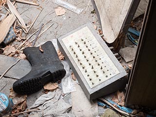 Control panel and boot lying on ground at Hotel Penguin Village