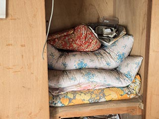 Futons in closet in Hotel Queen