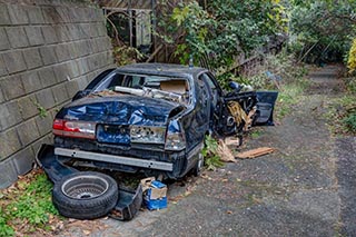 Trashed Toyota outside Hotel Skylove