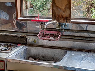 Kitchen sink in manager's apartment of Hotel Skylove