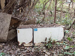 Refrigerator dumped in forecourt of Motel Akatsuki