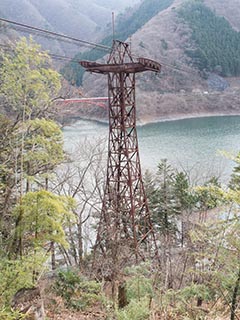 Abandoned Kawano Ropeway tower above Lake Okutama