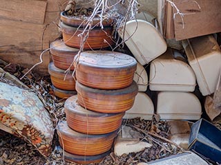 Old bento boxes stacked in room at abandoned love hotel Century