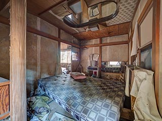 Filthy bed in abandoned love hotel Century