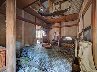 Filthy bed in abandoned love hotel Century