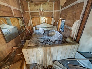 Filthy bed in abandoned love hotel Century