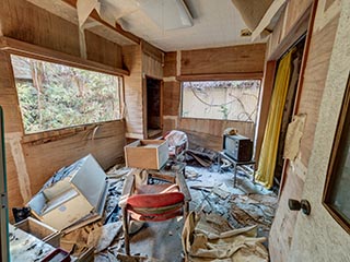 Filthy, decaying guest room at abandoned love hotel Century