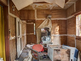 Filthy, decaying guest room at abandoned love hotel Century