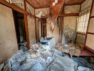 Garbage filled cottage at abandoned love hotel Century