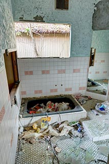 Garbage strewn bathroom in abandoned love hotel Century