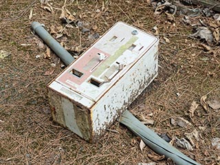 Vending machine dumped in forecourt of abandoned love Hotel Don Quixote