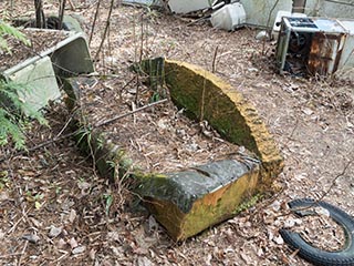 Sofa dumped in forecourt of abandoned love Hotel Don Quixote