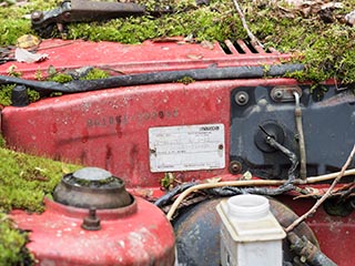 Abandoned Mazda in a field