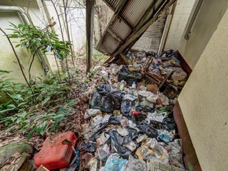 Garbage in carport of Motel Sun River