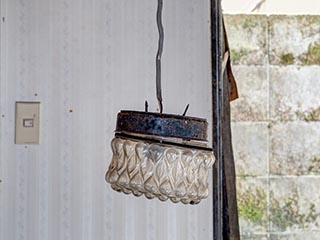 Dangling light in Motel Sun River