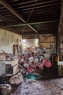 Pile of Pachinko Chairs in Abandoned Building in Murayama, Japan