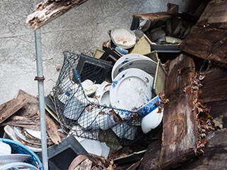 Basket of dishes in collapsing kitchen