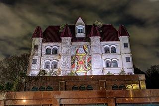 Queen Château Soapland lit up at night