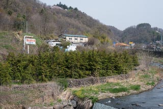 Abandoned Cow Shaped Building by River