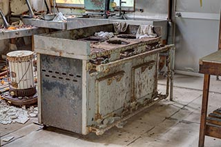 Gas Stove in Abandoned Restaurant Kitchen