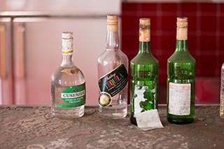 Bottles on Bar in Abandoned Sun Park Hotel