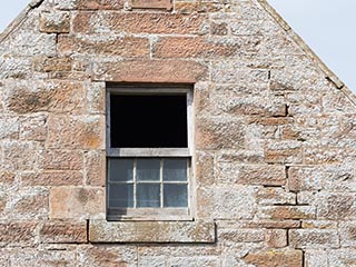 Upstairs window in abandoned storehouse