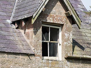 dormer window of abandoned house