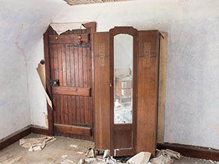 bedroom door and wardrobe in abandoned house