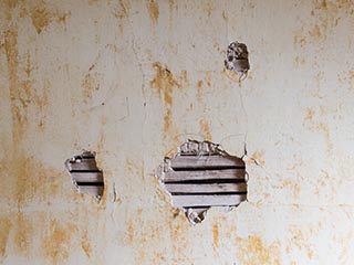 holes in lath and plaster wall